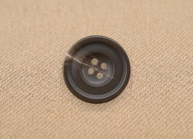A button photo whose background wipes away to a clean cutout on a transparent checkerboard